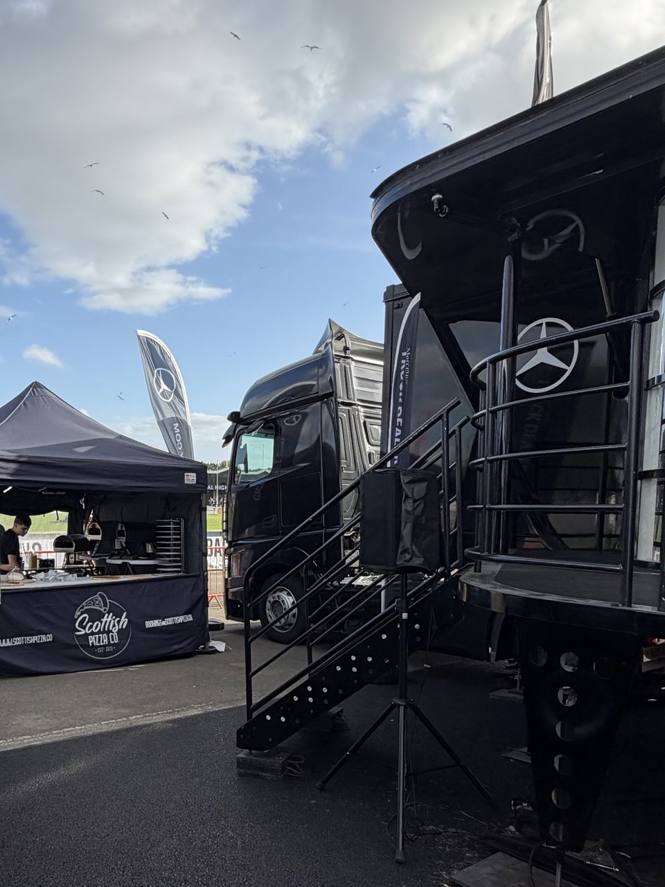 Scottish Pizza Co pop-up gazebo beside a Mercedes-Benz hospitality truck at a corporate event